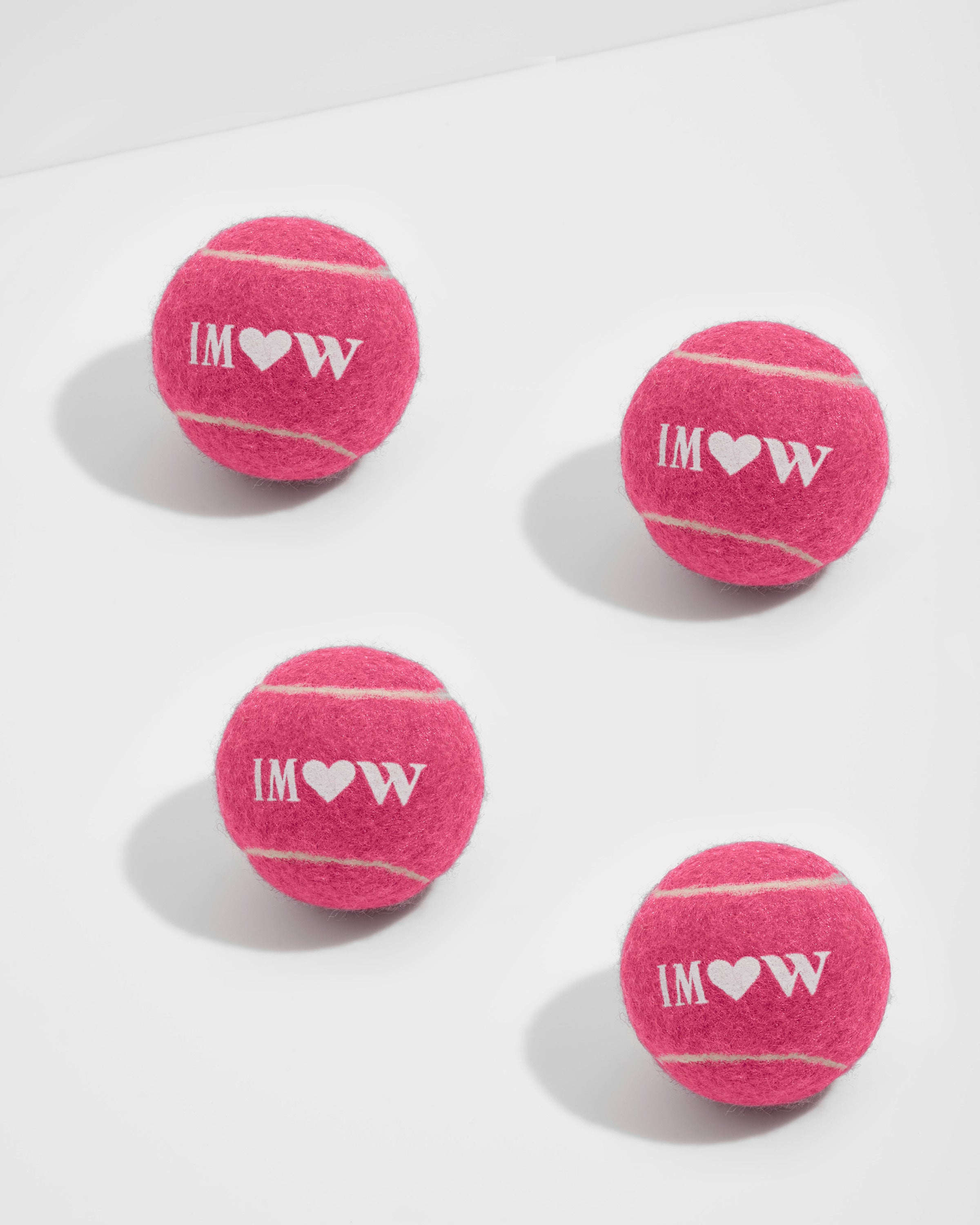 https://wildone.com/cdn/shop/products/WO_VM_Studio_PDP_IsaacMizrahi_TennisBall_Cosmopolitan_4Pack_01_4x5_Web.jpg?v=1678462425